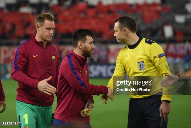 Lionel Messi of Barcelona and British referee Anthony Taylor during the UEFA Champions League group D football match between FC Barcelona and...