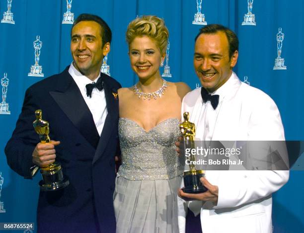Oscar Winner Actor Kevin Spacey, Mira Sorvino and Nicolas Cage backstage during 1996 Academy Awards Show, on March 25 in Los Angeles, California.