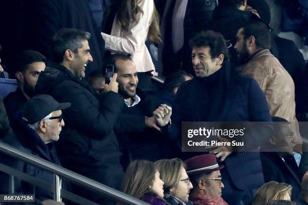 Gerard Darmon,Patrick Bruel and Ary Abittan are seen in the stands during the UEFA Champions League group B match between Paris Saint-Germain and RSC...