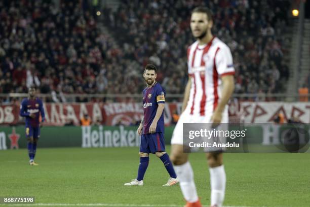 Lionel Messi of Barcelona gestures during a UEFA Champions League match between Olympiakos and Barcelona at the Giorgos Karaiskakis stadium in...