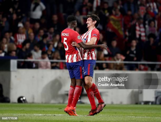 Thomas of Atletico Madrid celebrates his goal with Stefan Savic during the UEFA Champions League Group C soccer match between Atletico Madrid and...