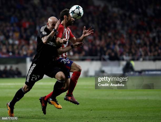 Juanfran of Atletico Madrid in action against Richard Almeida of Qarabag during the UEFA Champions League Group C soccer match between Atletico...