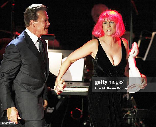 California Governor Arnold Schwarzenegger presents the "Courage To Care" Award to actress Jamie Lee Curtis at the "Noche de Ninos Gala" benefiting...