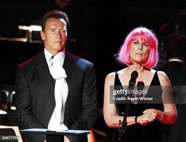 California Governor Arnold Schwarzenegger presents the "Courage To Care" Award to actress Jamie Lee Curtis at the "Noche de Ninos Gala" benefiting...