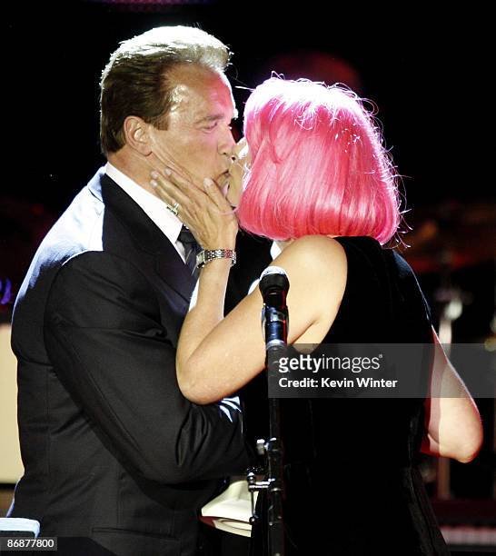 California Governor Arnold Schwarzenegger presents the "Courage To Care" Award to actress Jamie Lee Curtis at the "Noche de Ninos Gala" benefiting...