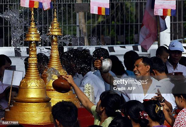 In this picture taken on May 8 Buddhist people celebrate at the Shwedagon pagoda on the occasion of the Kasone full moon day, in Yangon. The festival...