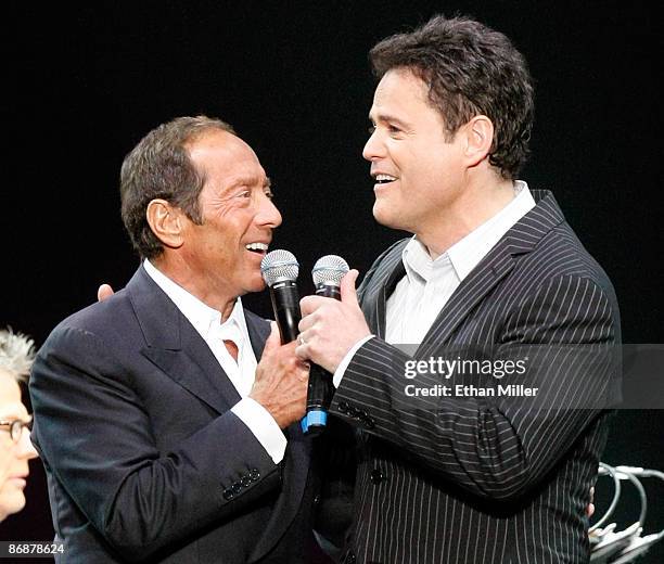 Singers Paul Anka and Donny Osmond perform the song "Puppy Love" together for the first time onstage during the "Hit Man: David Foster and Friends"...