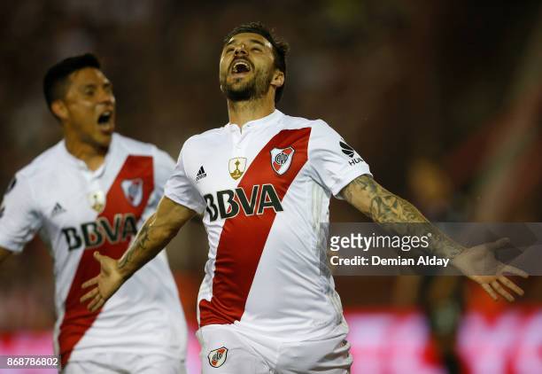 Ignacio Scocco of River Plate celebrates with teammate Enzo Perez after scoring the first goal of his team during a second leg match between Lanus...