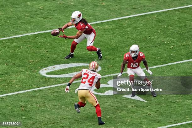 Arizona Cardinals wide receiver Larry Fitzgerald catches a pass as Arizona Cardinals wide receiver John Brown looks to block San Francisco 49ers...