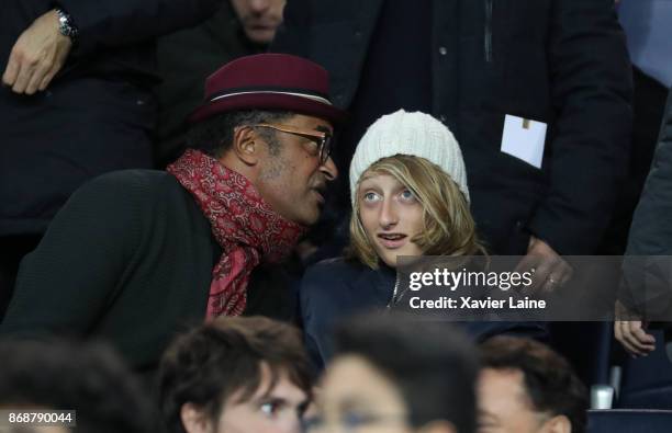 Yannick Noah and his son Joalukas Noah attend the UEFA Champions League group B match between Paris Saint-Germain and RSC Anderlecht at Parc des...