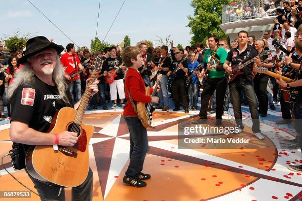 Guitarists are trying to perform for a world record during the live broadcast of the TV Show 'ZDF Fernsehgarten' at the ZDF TV gardens on May 10,...