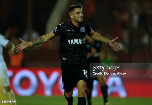 Alejandro Silva celebrates after scoring the fourth goal of his team during a second leg match between Lanus and River Plate as part of the...