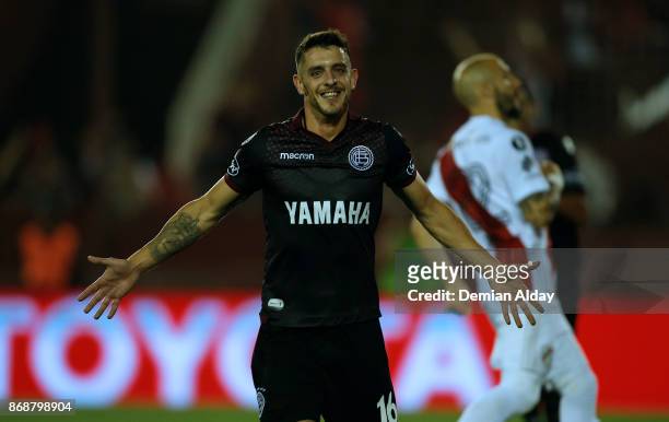Alejandro Silva celebrates after scoring the fourth goal of his team during a second leg match between Lanus and River Plate as part of the...