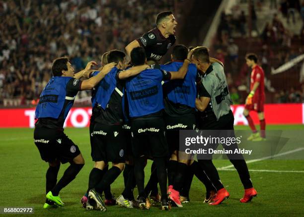 Players of Lanus celebrate after winning a second leg match between Lanus and River Plate as part of the semifinals of Copa CONMEBOL Libertadores...