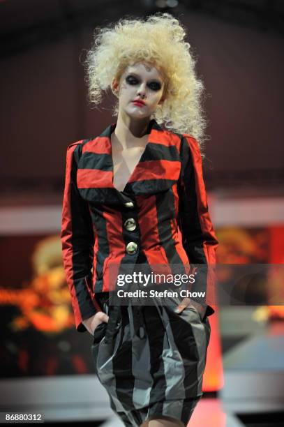 Model showcases designs by Vivienne Westwood for her Autumn/Winter 2009 collection on the catwalk at the Ngee Ann City Civic Plaza on Day 5 and last...