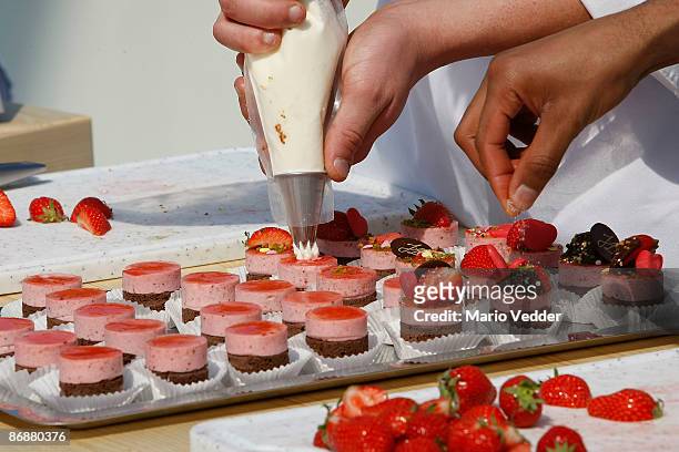Chef Johann Lafer prepares a dessert with strawberries during the live broadcast of the TV Show 'ZDF Fernsehgarten' on May 10, 2009 at the ZDF TV...