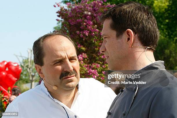 Chef Johann Lafer talks to TV chef Alexander Herrmann during the live broadcast of the TV Show 'ZDF Fernsehgarten' on May 10, 2009 at the ZDF TV...