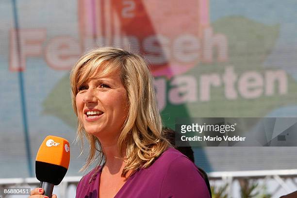 Host Andrea Kiewel smiles during the live broadcast of her TV Show 'ZDF Fernsehgarten' at the ZDF TV gardens on May 10, 2009 in Mainz, Germany.