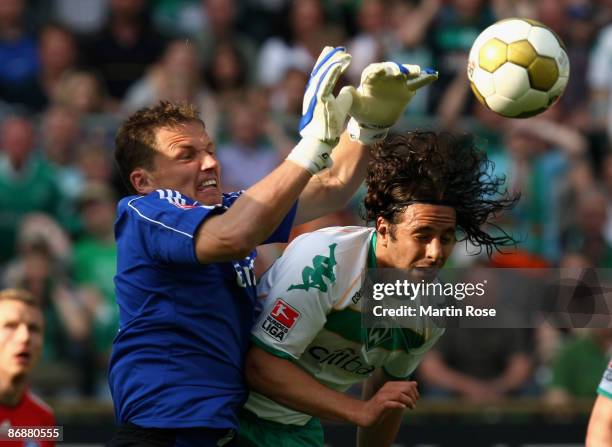 Claudio Pizarro of Bremen and Frank Rost , goalkeeper of Hamburg compete for the ball during the Bundesliga match between Werder Bremen and Hamburger...