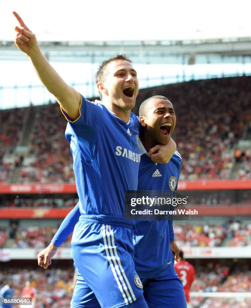 Ashley Cole of Chelsea is congratulated by team mate Frank Lampard after his shot was deflected in by Kolo Toure of Arsenal for the third goal of the...