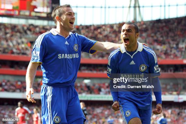 Ashley Cole of Chelsea is congratulated by team mate Frank Lampard after his shot was deflected in by Kolo Toure of Arsenal for the third goal of the...