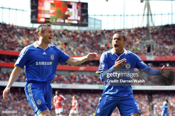 Ashley Cole of Chelsea is congratulated by team mate Frank Lampard after his shot was deflected in by Kolo Toure of Arsenal for the third goal of the...