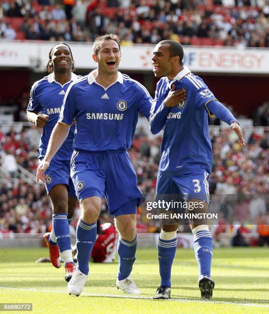 Chelsea's Ashley Cole and teammates Frank Lampard and Didier Drogba celebrate the own-goal by Arsenal's Ivory Coast player Kolo Toure during their...