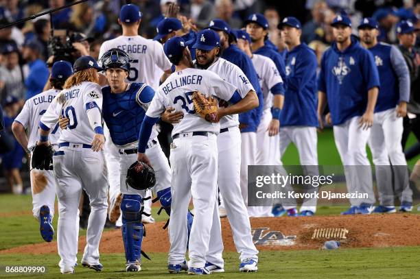 Kenley Jansen of the Los Angeles Dodgers celebrates with Cody Bellinger after defeating the Houston Astros 3-1 in game six of the 2017 World Series...