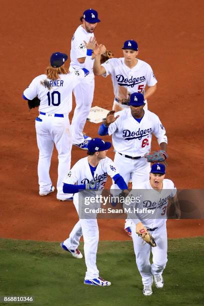 The Los Angeles Dodgers celebrate after defeating the Houston Astros 3-1 in game six of the 2017 World Series at Dodger Stadium on October 31, 2017...