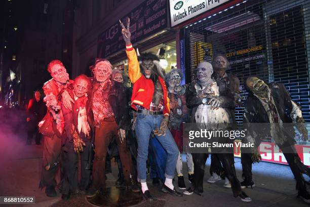 Heidi Klum poses with her zombies as she enters Heidi Klum's 18th Annual Halloween Party presented by Party City and SVEDKA Vodka at Magic Hour...