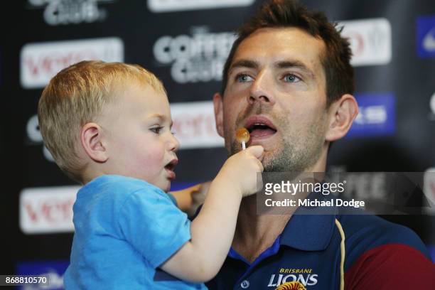 In this series Brisbane Lions recruit Luke Hodge is offered a lolipop by son Leo as he speaks to the media during a Brisbane Lions AFL media...