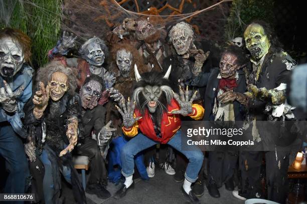 Heidi Klum poses with her zombies attend Heidi Klum's 18th Annual Halloween Party presented by Party City and SVEDKA Vodka at Magic Hour Rooftop Bar...