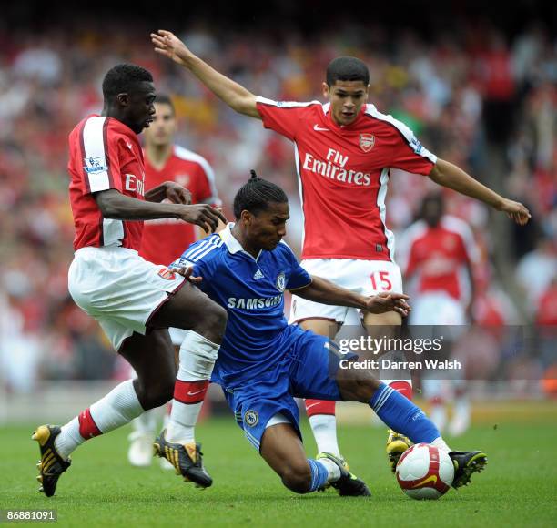 Kolo Toure and Denilson of Arsenal battle with Florent Malouda of Chelsea during the Barclays Premier League match between Arsenal and Chelsea at the...