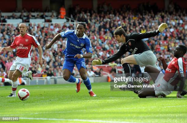 Kolo Toure of Arsenal deflects the ball in his own net for the third goal of the game during the Barclays Premier League match between Arsenal and...