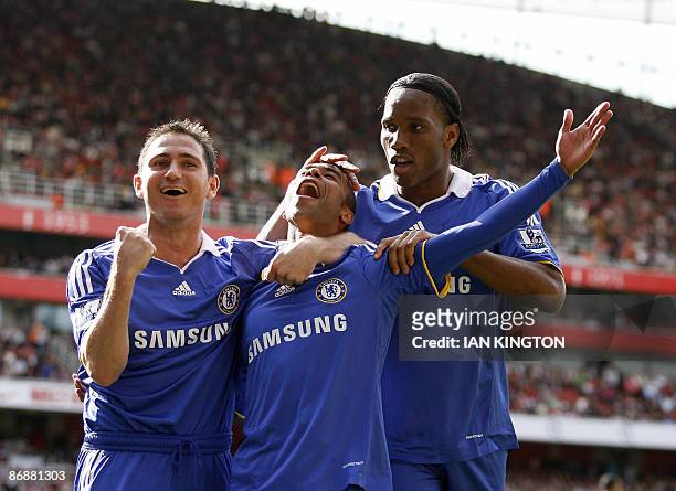 Chelsea's Ashley Cole , Chelsea's Frank Lampard and Chelsea's Ivory Coast footballer Didier Drogba celebrates the own goal by Arsenal's Ivory Coast...