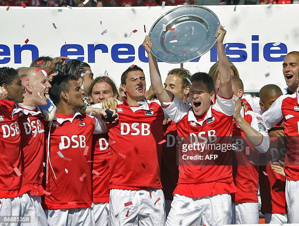 Alkmaar's Stijn Schaars holds the champion plate as they are Champions of the Netherlands on May 10, 2009 after their Dutch league football match...