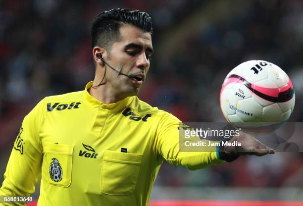 Referee Adonai Escobedo holds the ball during the quarter final match between Chivas and Atlante as part of the Copa MX Apertura 2017 at Chivas...