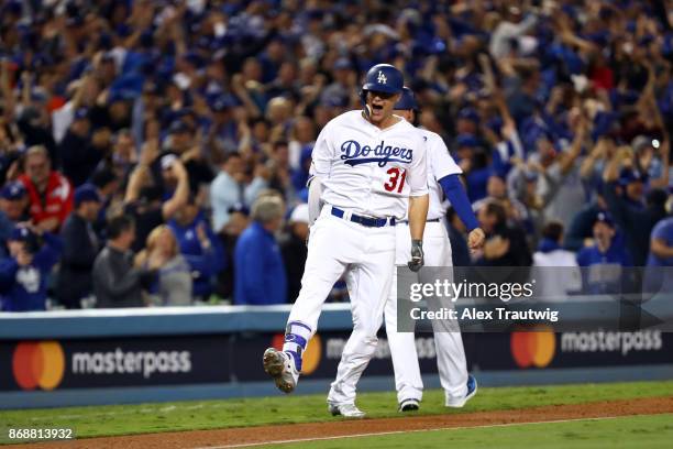 Joc Pederson of the Los Angeles Dodgers rounds the bases after hitting a solo home run in the seventh inning during Game 6 of the 2017 World Series...