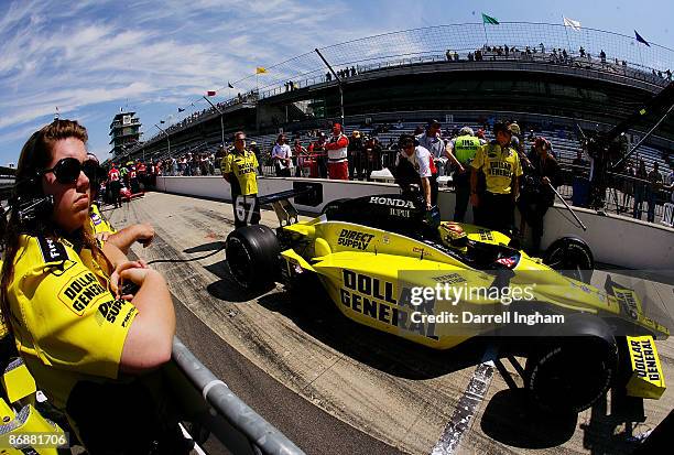 Crew member looks on as Sarah Fisher, driver of the Dollar General Sarah Fisher Racing Dallara Honda prepares to qualify for the IRL IndyCar Series...