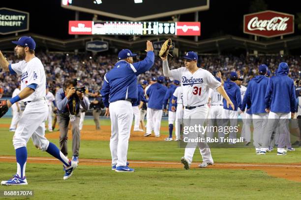 Joc Pederson of the Los Angeles Dodgers celebrates with manager Dave Roberts after the Dodgers defeated the Houston Astros in Game 6 of the 2017...