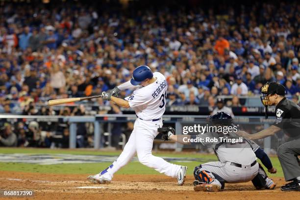 Joc Pederson of the Los Angeles Dodgers hits a solo home run in the seventh inning during Game 6 of the 2017 World Series against the Houston Astros...