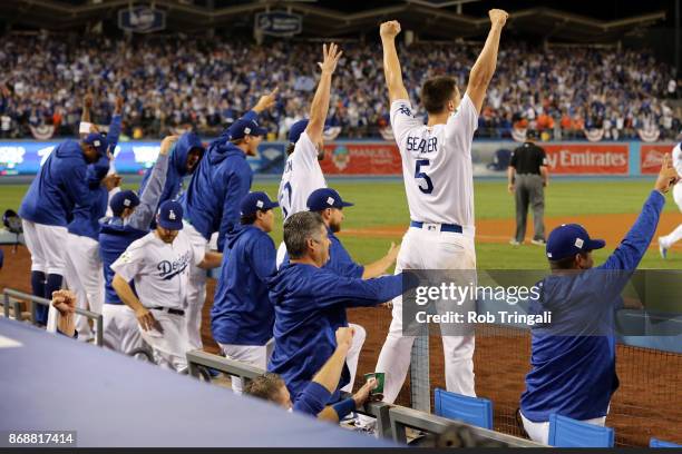 The Dodgers bench reacts to a Joc Pederson solo home run in the seventh inning during Game 6 of the 2017 World Series against the Houston Astros at...