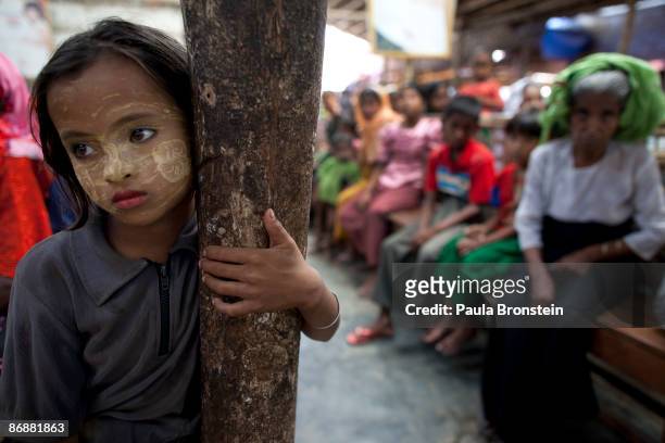 Burmese girl waits for the malaria test results at special clinic for malaria on May 4, 2009 in Sittwe, Arakan state, Myanmar . The majority of the...