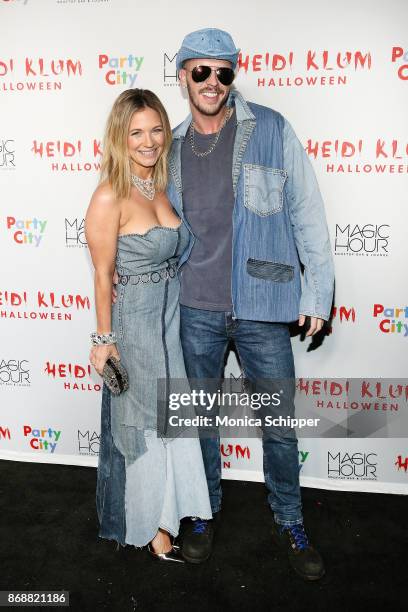 Vanessa Ray and Jake Wilson attend Heidi Klum's 18th Annual Halloween Party at Magic Hour Rooftop Bar & Lounge on October 31, 2017 in New York City.