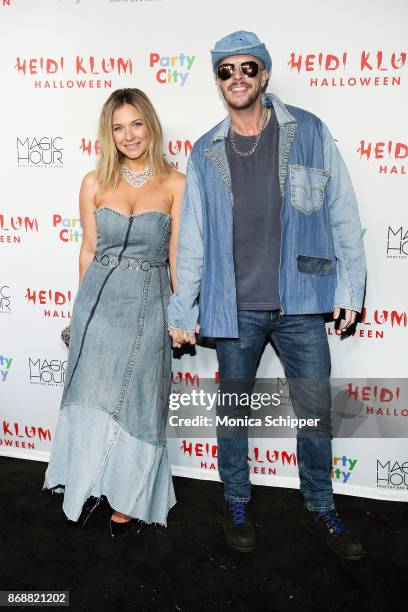 Vanessa Ray and Jake Wilson attend Heidi Klum's 18th Annual Halloween Party at Magic Hour Rooftop Bar & Lounge on October 31, 2017 in New York City.