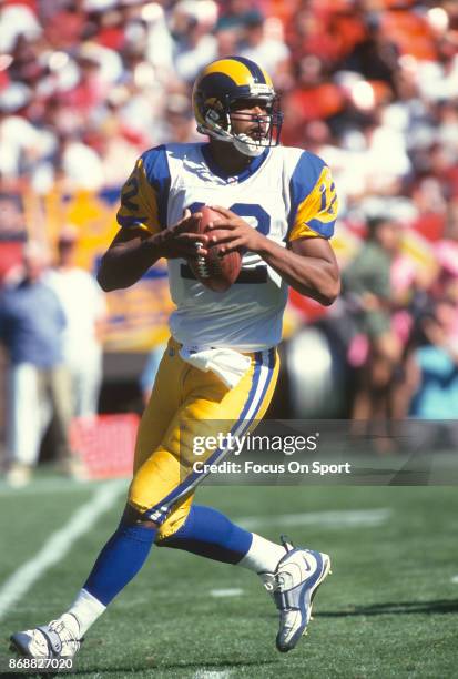 Tony Banks of the St. Louis Rams looks to pass against the San Francisco 49ers during an NFL football game October 12, 1997 at Candlestick Park in...