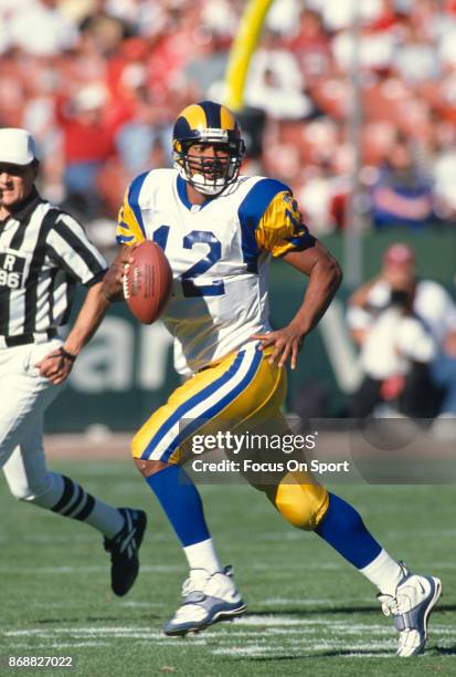 Tony Banks of the St. Louis Rams looks to pass against the San Francisco 49ers during an NFL football game October 12, 1997 at Candlestick Park in...