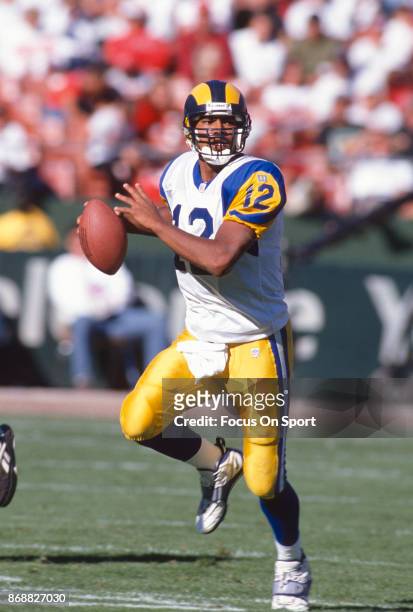 Tony Banks of the St. Louis Rams looks to pass against the San Francisco 49ers during an NFL football game October 12, 1997 at Candlestick Park in...
