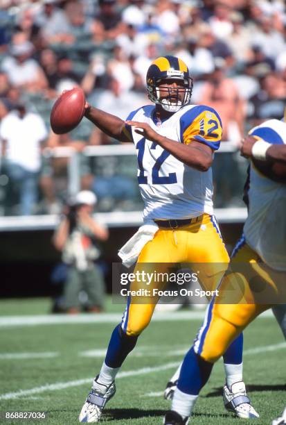 Tony Banks of the St. Louis Rams looks to pass against the Oakland Raiders during an NFL football game September 28, 1997 at the Oakland-Alameda...