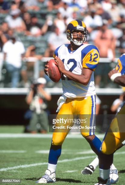 Tony Banks of the St. Louis Rams looks to pass against the Oakland Raiders during an NFL football game September 28, 1997 at the Oakland-Alameda...